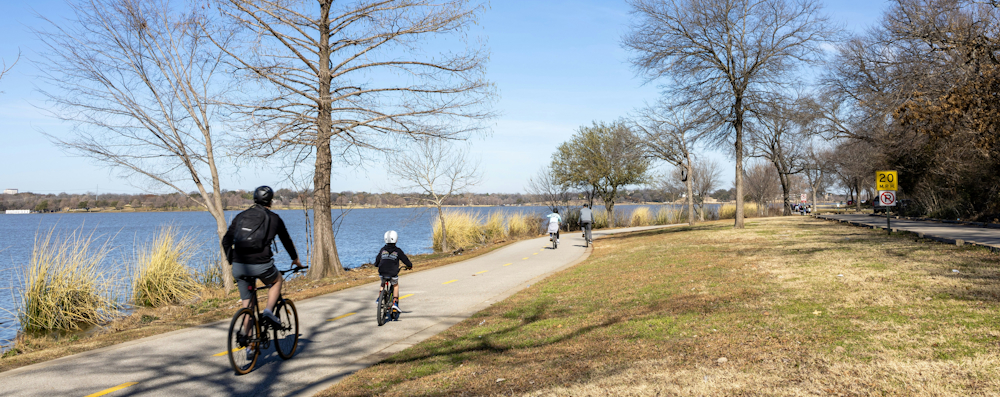 Cyclists on a White Rock Lake Trail in Dallas by Matthew Thompson on Unsplash
