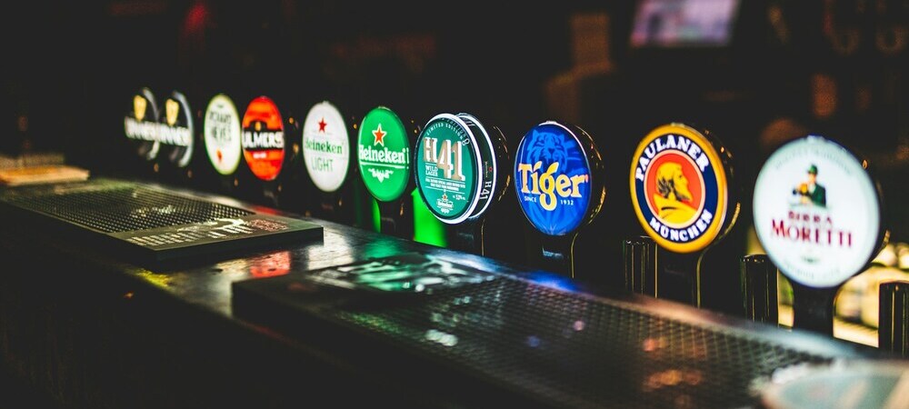 Beer taps in a Dublin pub by George Bakos