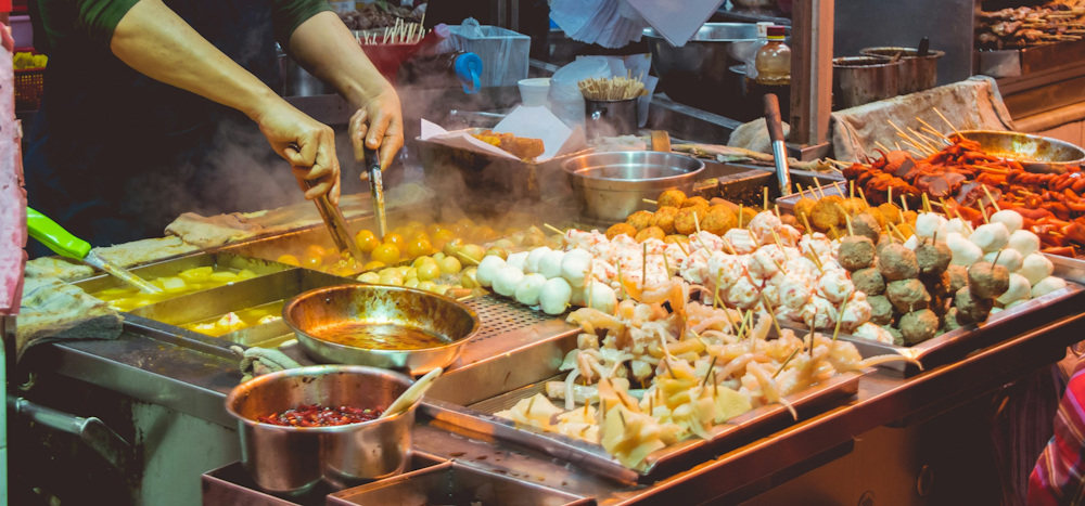 Street Food Stall in Hong Kong by Vernon Raineil Cenzon on Unsplash