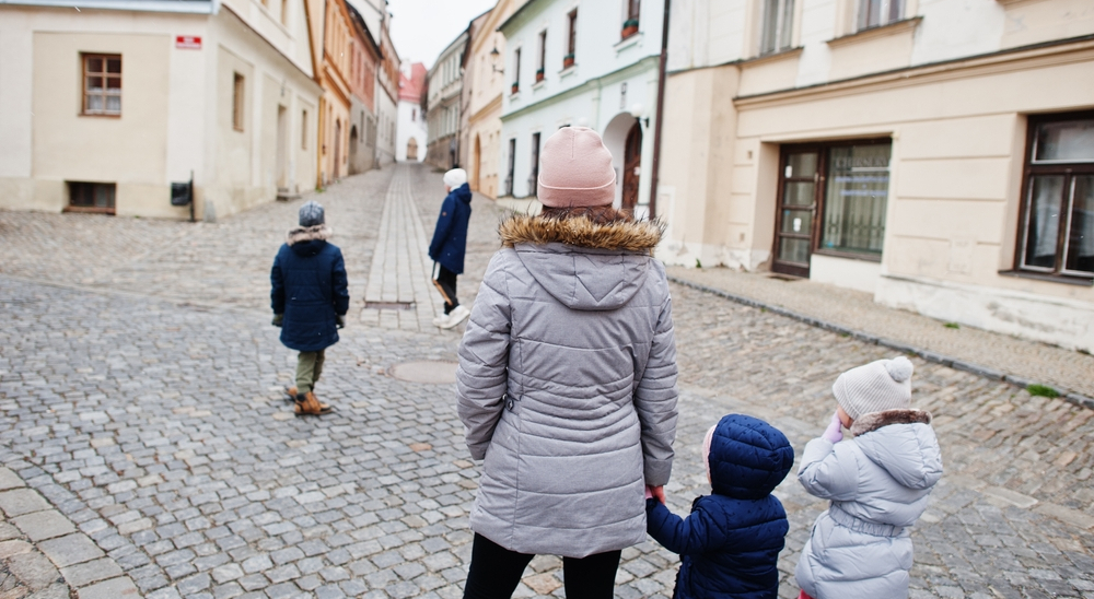Family on the cobbled streets of the Czech Republic