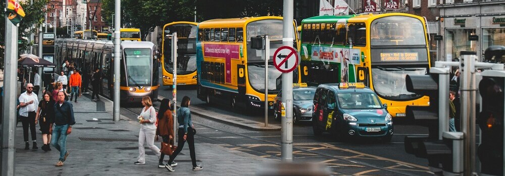 Buses, cars, and pedestrians in Ireland by NIR HIMI