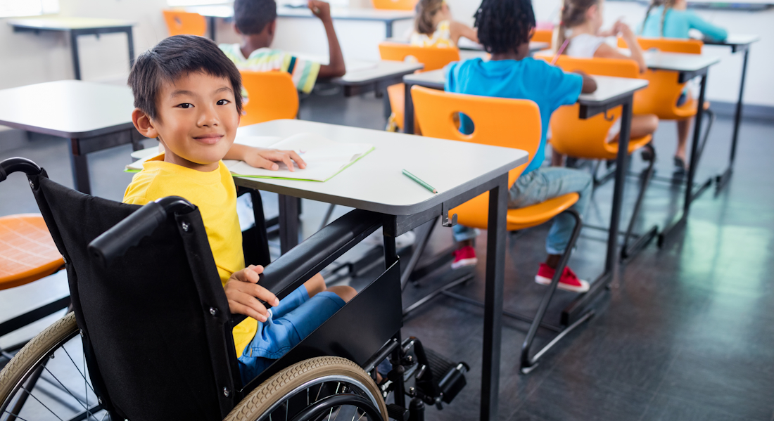 student using a wheelchair in a classroom