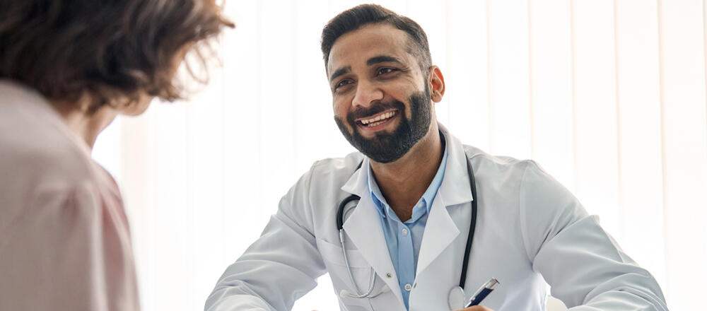 Indian doctor with a patient